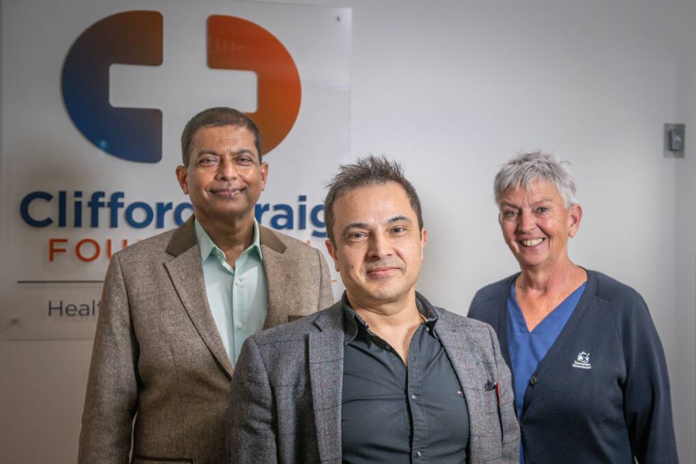 Dinesh Tryambake and Mahesh Dhakal both staff specialist in acute medicine, with site clinical trial coordinator Monika O'Connor at the Clifford Craig Foundation in Launceston. Picture by Craig George