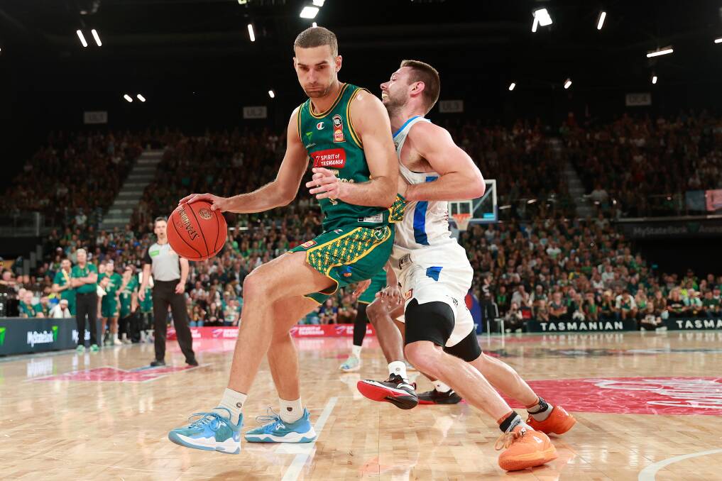 Tasmania JackJumper Jack Mcveigh and Melbourne United's Matthew Dellavedova were the stars of game four of the NBL championship series. Picture by Kelly Defina/Getty Images