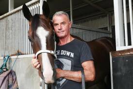 Legendary Tasmanian horse trainer Gary White, pictured with Heaven's Bonus, has retired following a career spanning five decades. Picture on Gary White Racing Facebook