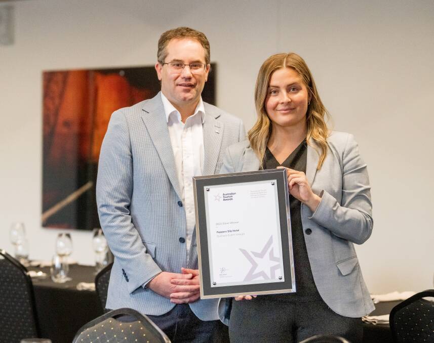 General manager Paul Seaman with associate director of sales Ruby Hardman, showcasing their certificate for silver in the business event venues category.
