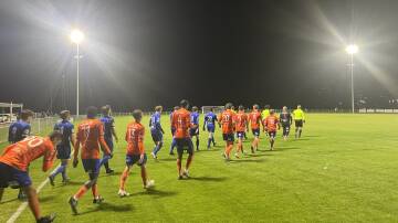 Riverside Olympic and Launceston United players take to the pitch on Friday night. Picture by Rob Shaw