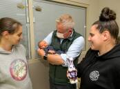 Jeremy Rockliff cradles four-day-old baby Rydar with Kayla Bowerman and Libby Kerkham.