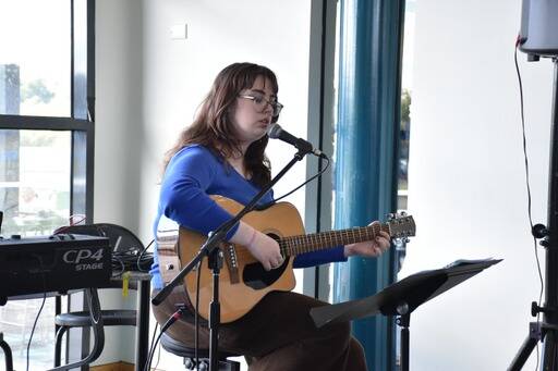 Music student Imogen Prince supplying the school cafe with live music for the inargural Autumn Festival. 