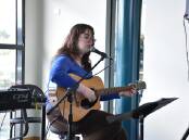 Music student Imogen Price supplying the school cafe with live music for the inargural Autumn Festival. 