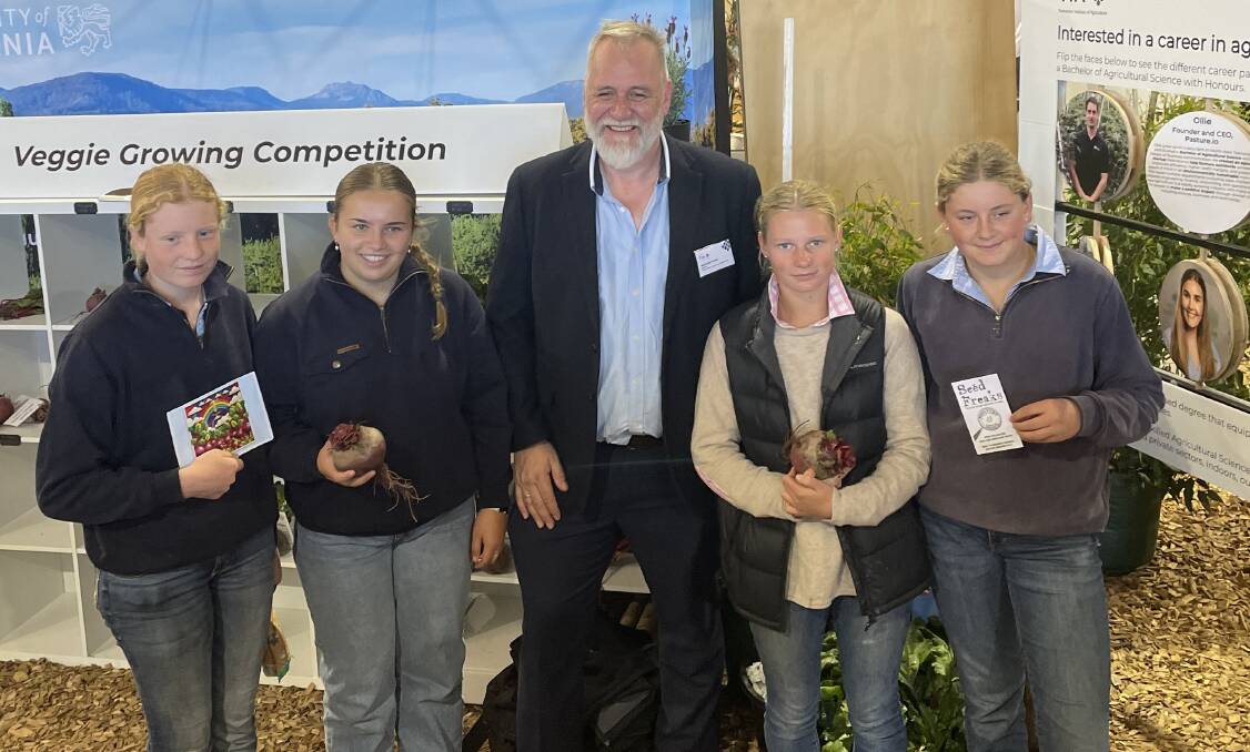 Grade nine students from Launceston Grammar Church School, Charlotte Green, Isabel Archer, Gracie Hirst and Penny Green with director of the Tasmanian Institute of Agriculture, Professor Mike Rose. Let it Grow competition at Agfest 2024. Picture by Saree Salter