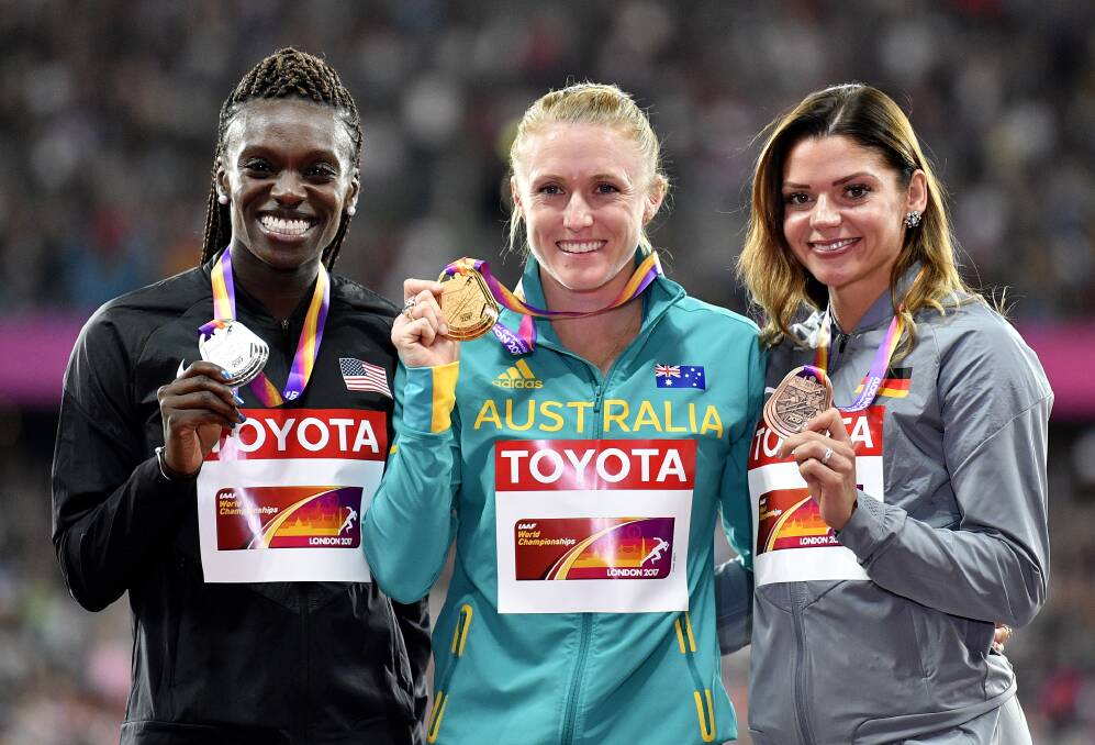 Sally Pearson, silver medallist United States' Dawn Harper Nelson and bronze medalist Germany's Pamela Dutkiewicz. Picture: AP