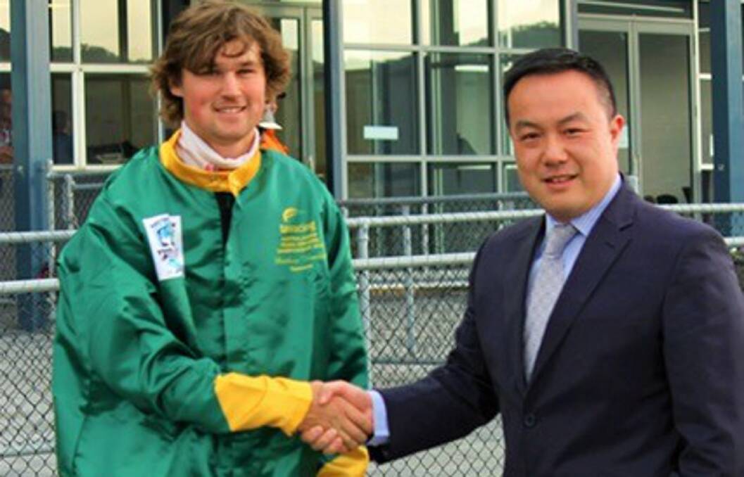 FLYING COLOURS: Matthew Howlett receives his Tasmanian colours from Tasracing CFO John Luk before heading to the Australasian Young Driver Championships where he'll compete against other rising stars.