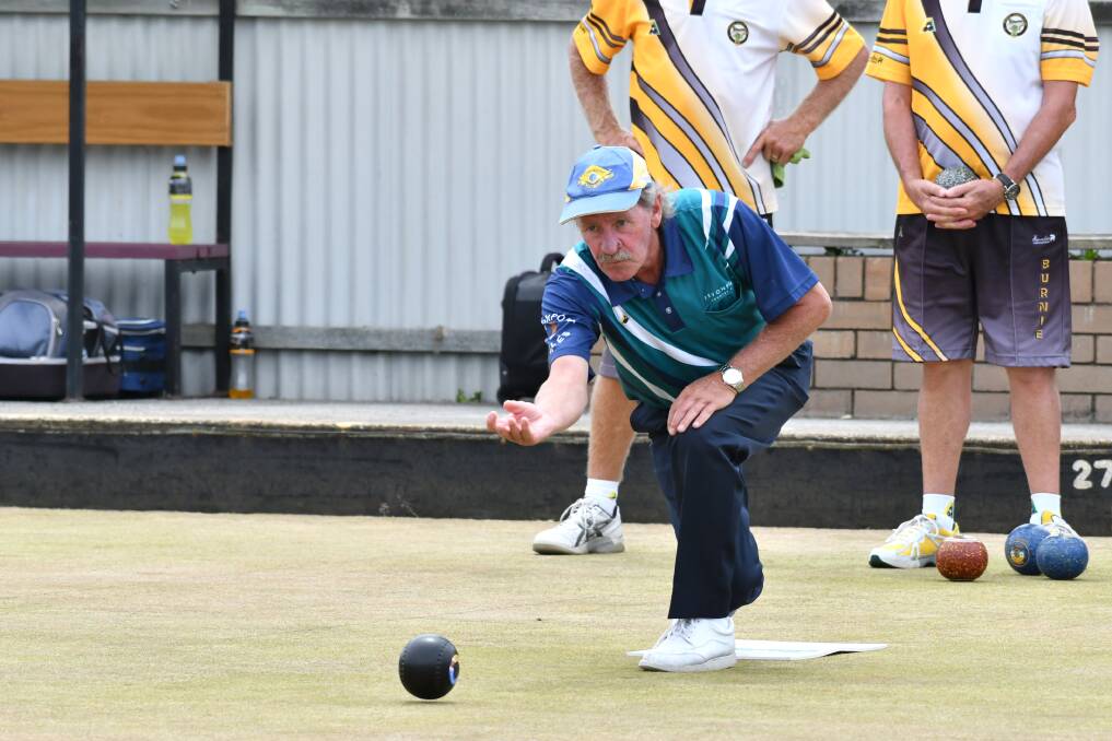 PRECISION: Devonport Eagle Alan Corbett guides his bowl down the green in the Premier League match against Burnie. Burnie inflicted a massive 40-shot defeat on the Eagles. Picture: Brodie Weeding.