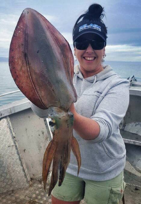 PLENTIFUL BOUTY: Hannah Ledger shows off the massive squid she caught in Great Oyster Bay on the East Coast.