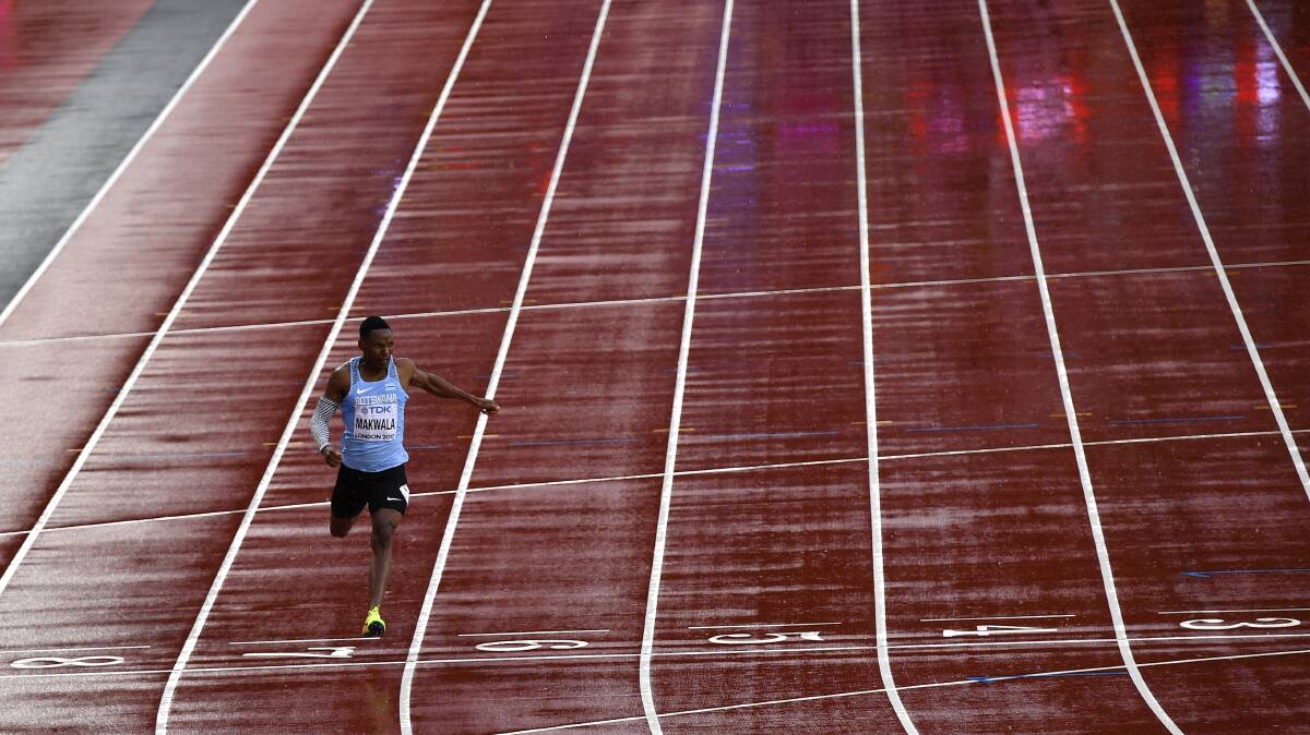 GOING SOLO: Botswana's Isaac Makwala crosses the finish line in his men's 200m individual time trial during the World Athletics Championships. Picture: AP Photo/Martin Meissner