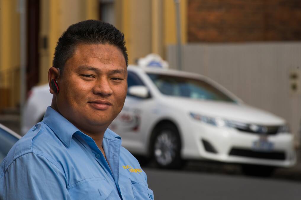 NEW BEGINNINGS: Mohan Hangkhim spent 20 years as a refugee in Nepal and now he and his family happily call Tasmania home. He has three children and he sees the opportunties available for them. Picture: Phillip Biggs