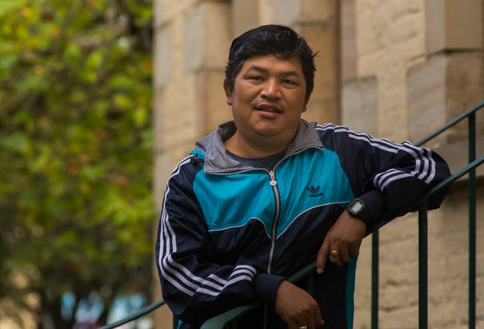 HOME: After two decades in a Bhutanese refugee camp, Jug Rai and his family came to Tasmania where they encountered the challenges of a different world. Picture: Phillip Biggs