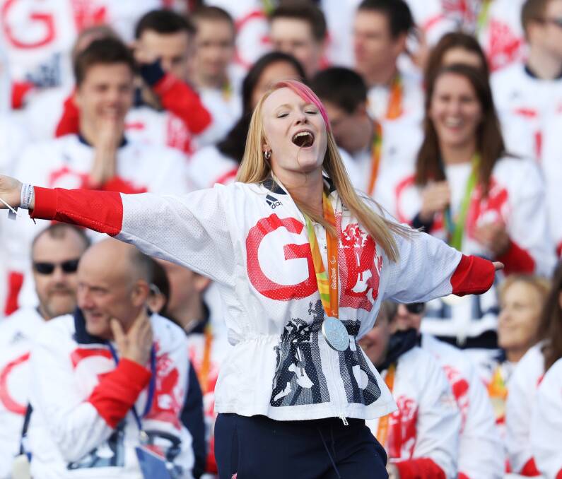 SPORTING GREATS: Archer Jodie Grinham celebrates during the Olympics & Paralympics Team GB - Rio 2016 Victory Parade. The teams received a heroes' welcome. Photo: Dan Kitwood/Getty Images