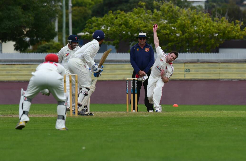 FIRE POWER: Latrobe bowler Lachlan Walsh thunders down the wicket toward Devonport's Brent Lawler as partner Anish Paraam prepares to run. Pictures: Paul Scambler