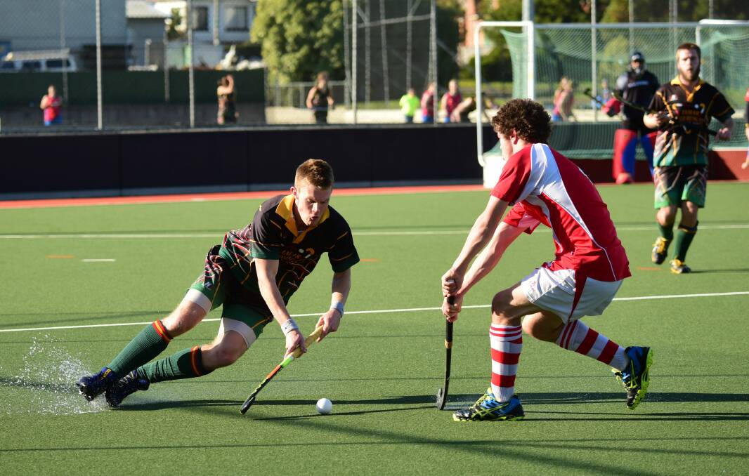 FANCY FOOTWORK: Tamar Churinga's Justin Ockerby makes a slippery opponent for City Marians' Kyle Wescombe. Picture: Paul Scambler