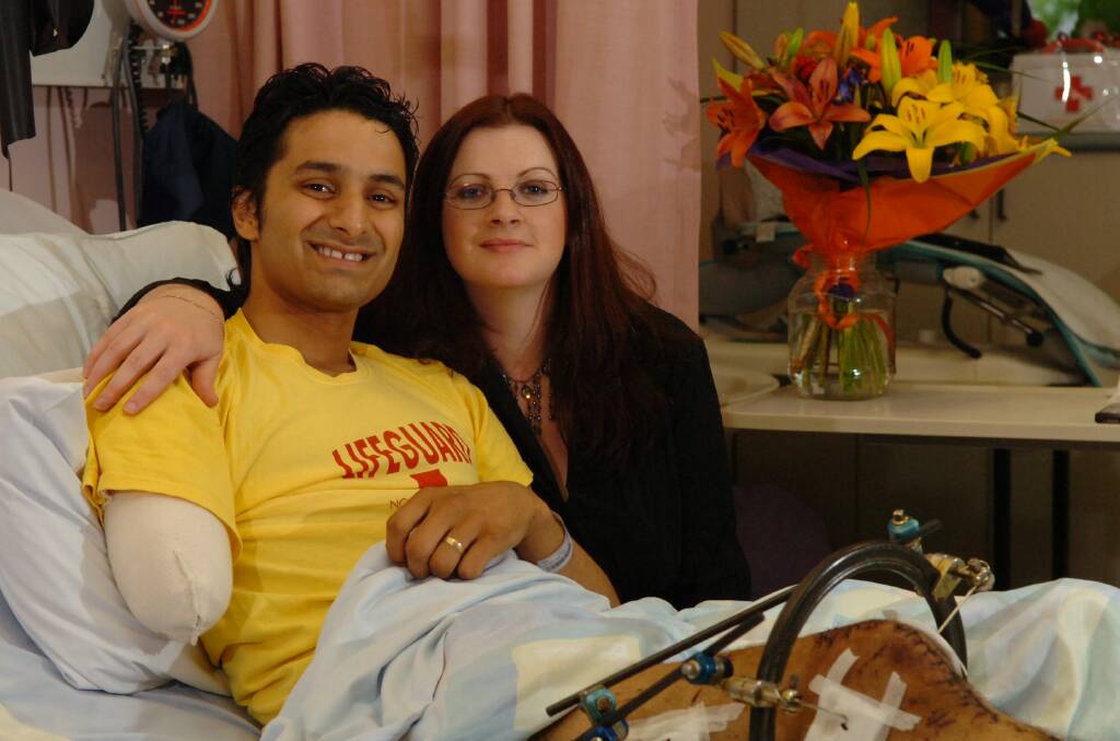 MIRACLE SURVIVAL: Sam Cawthorn, with his wife Kate, recovering at the Launceston General Hospital after his crash in October, 2006. 