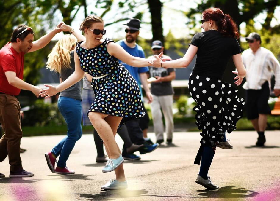 DANCE OFF: Swing-dancer Whitney McKinnell and event organiser Cassandre Tickner Smith dance up a storm in Prince's Square during Swingmania. Picture: Scott Gelston