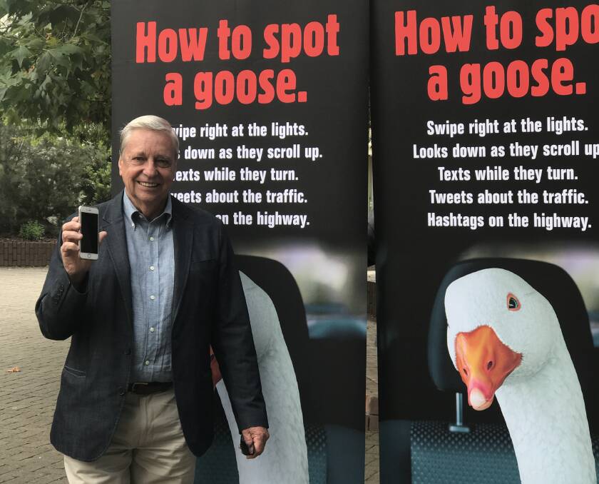 RSAC Tasmania chairman Jim Cox promoting the council's latest campaign, targeting drivers using their mobile phones.