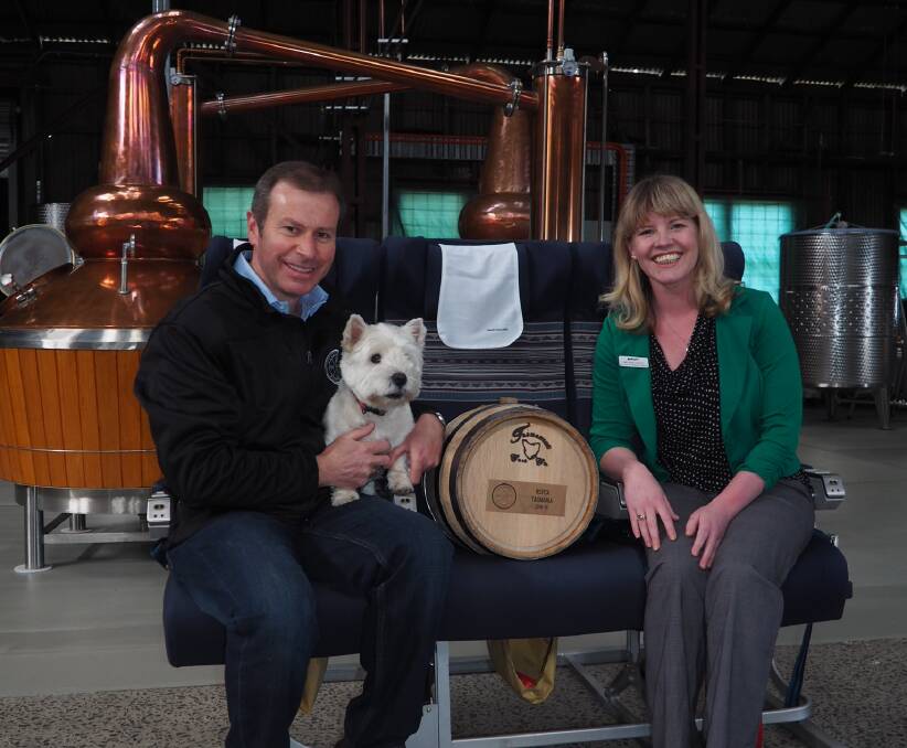 DONATION: Launceston Distillery production manager Chris Condon with Angus the distillery dog and RSPCA Tasmania marketing and fundraising coordinator Melanie Knight. Picture: Melissa Mobbs.