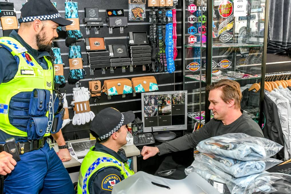 CRACKDOWN: Wanted Streetwear owner and Launceston Retail Watch founder Luke Dawson with Sergeant Stuart Greenwood and Constable Benjamin Pearce-Lieutier. PIcture: Phillip Biggs