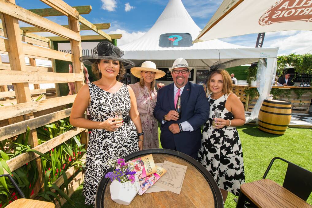 BOTTOMS UP: Kelly Brown, Karen Filliponi, Darren Alexander and Rachel Butt enjoying a drink in the What's On In App marquee at the Launceston Cup.