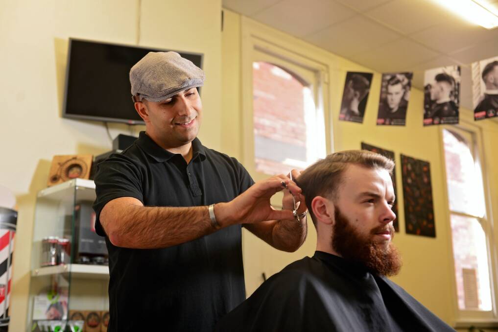SUCCESS: Iranian barber Alireza Kaveh Rad has found success since relocating to Tasmania eight years ago. PICTURE: Phillip Biggs.