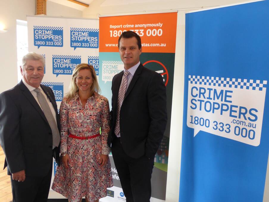 Crime Stoppers Tasmania deputy chairman David Daniels, chairwoman Amanda Castray, and chief executive Ron Franks at the launch of Crime Stoppers Week 2017 in May.