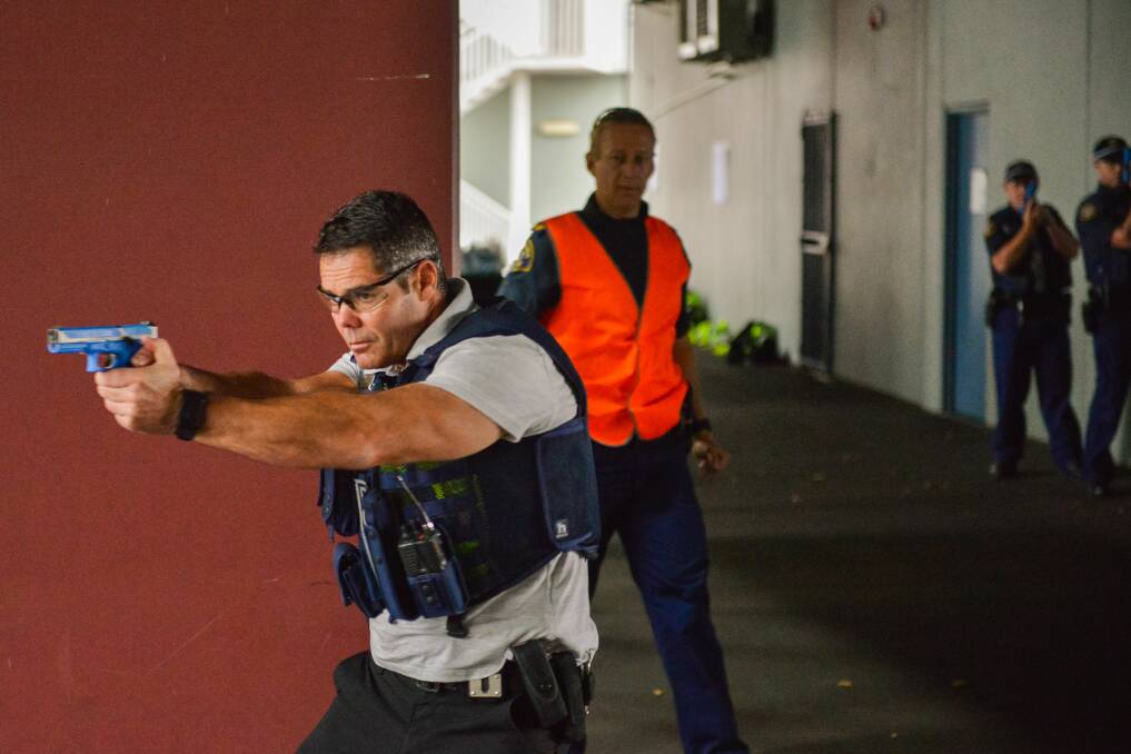 EXERCISE: Tasmania Police Sergeant Glenn Evans taking part in tactical response training at University of Tasmania Stadium on Wednesday. Pictures: Phillip Biggs