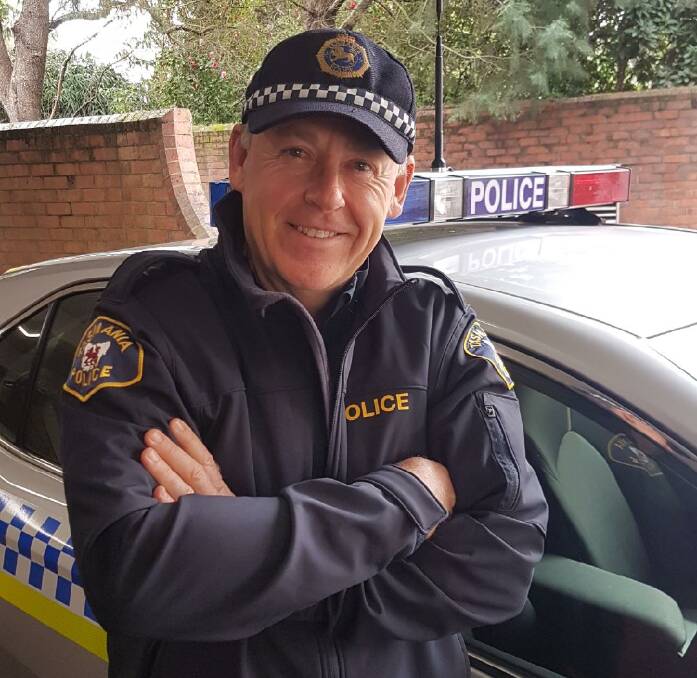 GENEROUS: Constable Dave Simpson has been identified as the police officer photographed buying a homeless man a coffee and lunch in Launceston this week.  
