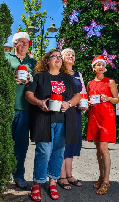 The Benevolent Society's John Stuart, The Salvation Army's Anita Reeve, St Vincent de Paul's Ann Piper, and City Mission's Vanessa Cahoon gear up for The Examiner's empty stocking appeal. Picture: Scott Gelston.