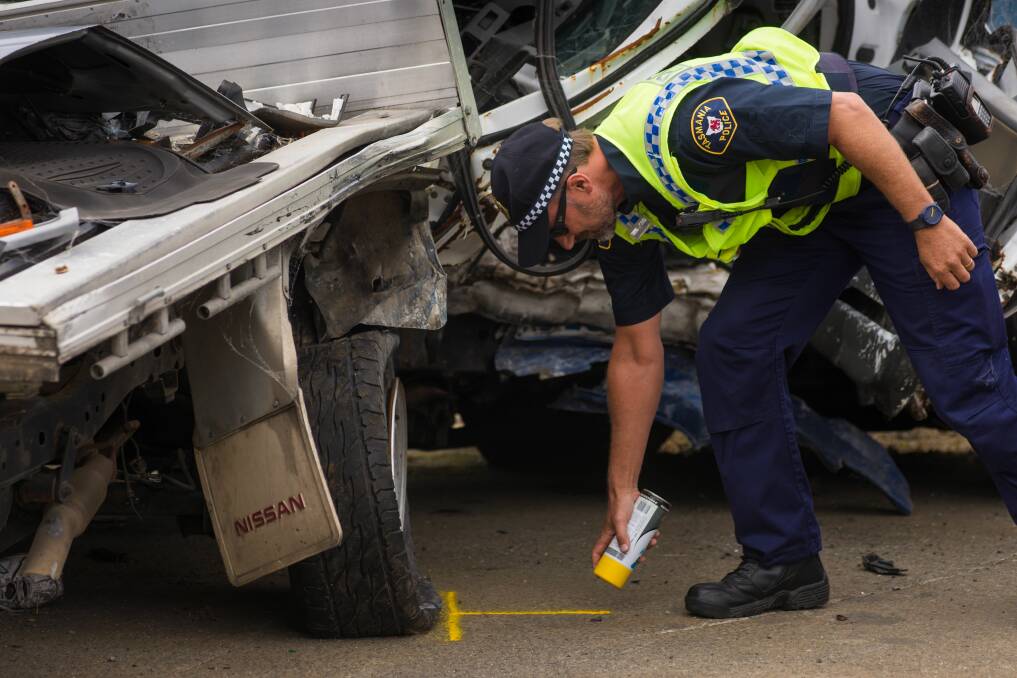 AT THE SCENE: First-Class Constable Nigel Housego has attended 62 fatal crashes and hundreds of serious crashes in his 10 year as a crash investigator. Pictures: Phillip Biggs
