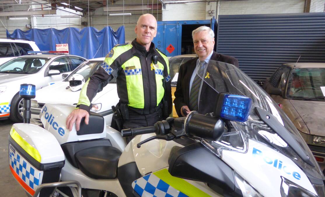 STAYING SAFE: Sergeant Nick Hodgkinson and Road Safety Advisory Council chairman Jim Cox promote motorcycle safety for National Road Safety Week 2017.