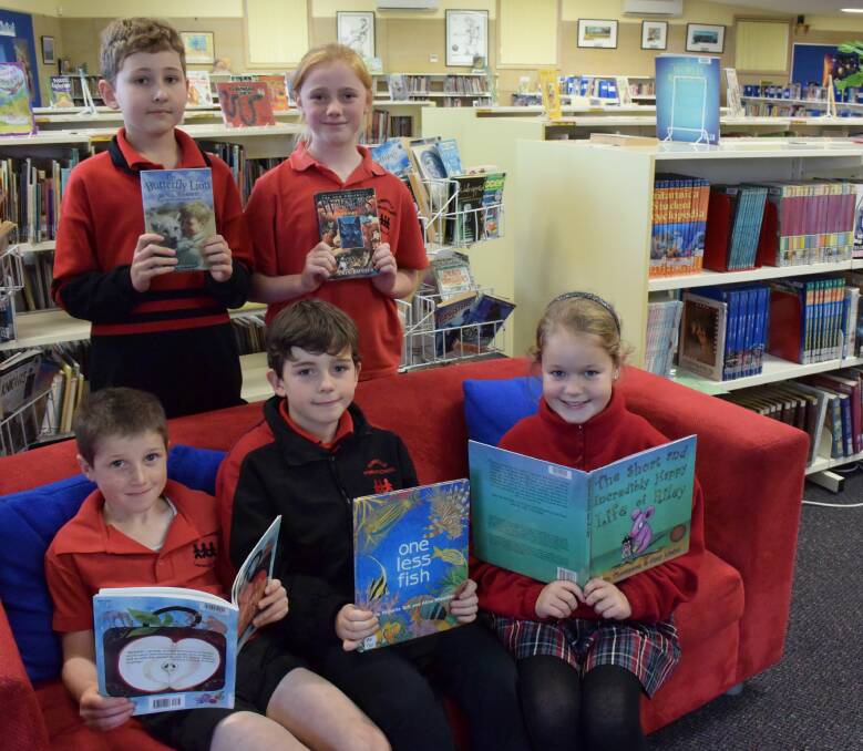 READERS: Summerdale Primary School students Aiden Tripathi, 11, Lauren Brooks, 11, Diesel Walters, 7, Alex Hampton, 9, and Madison West, 9, get reading for the Premier's Reading Challenge. Picture: Michelle Wisbey