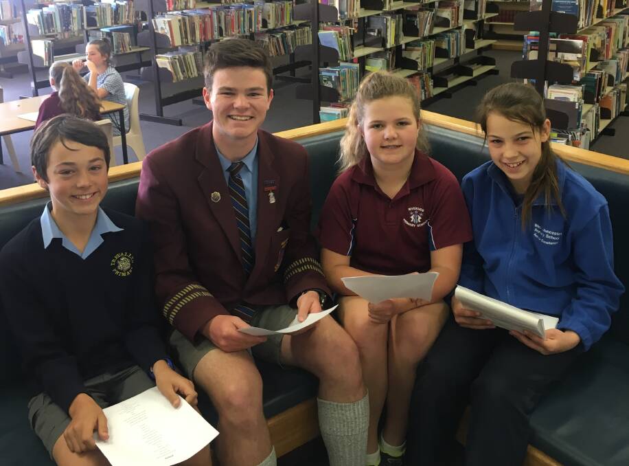 WORKING TOGETHER: Angus Purtell, Ryan Moreton, Maisie Burns and Amelia Hanson work on their creative writing skills at The Write Road workshop. Picture: Michelle Wisbey 