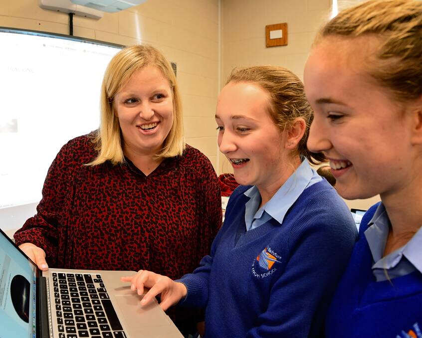 FUTURE SCIENTISTS: Astronomer and former Exeter High School student Shari Breen discusses pulsar measurements with students Elizabeth Jones and Grace Younger. Picture: Phillip Biggs 