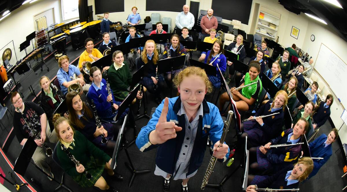 MAKING MUSIC: Flute player Merran Clay, 13, celebrates with her band mates after winning at the New South Wales State Band Championships. Picture: Paul Scambler 