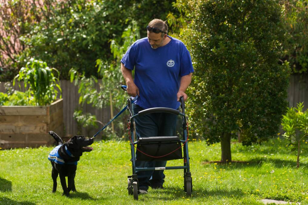 UNBREAKABLE BOND: Mark Charlton and his service dog Bess, who has offered him practical assistance and companionship. Picture: Phillip Biggs 