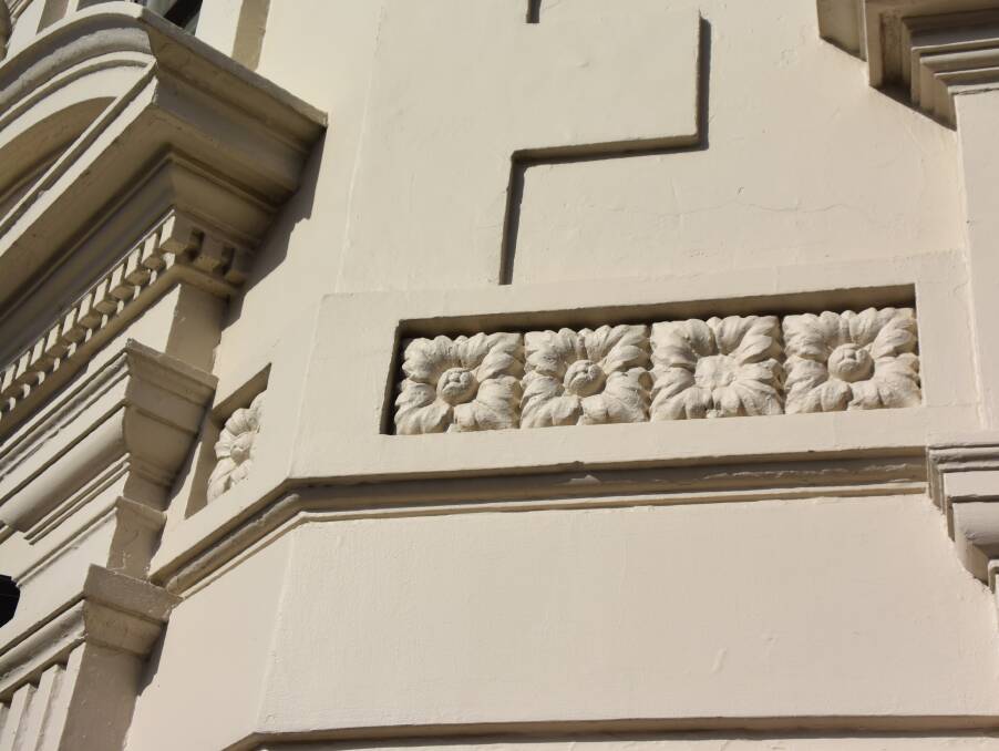 EXTERIOR ART: Floral detail adorns the building's distinctive 165-year-old exterior. 