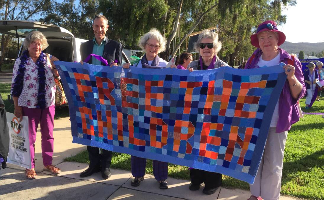 TASSIE NANNAS: Jane Broad, Tasmanian Greens Senator Nick McKim, Patricia Moran, Rosemary Scott and Margaret Eldridge hold the Tassie Nannas' banner in Canberra. 