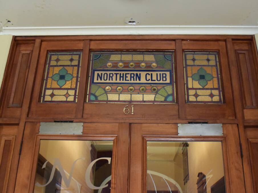 REMINDERS OF THE PAST: A stained-glass sign alludes to the building's past purpose acting as the base for the Northern Club. 