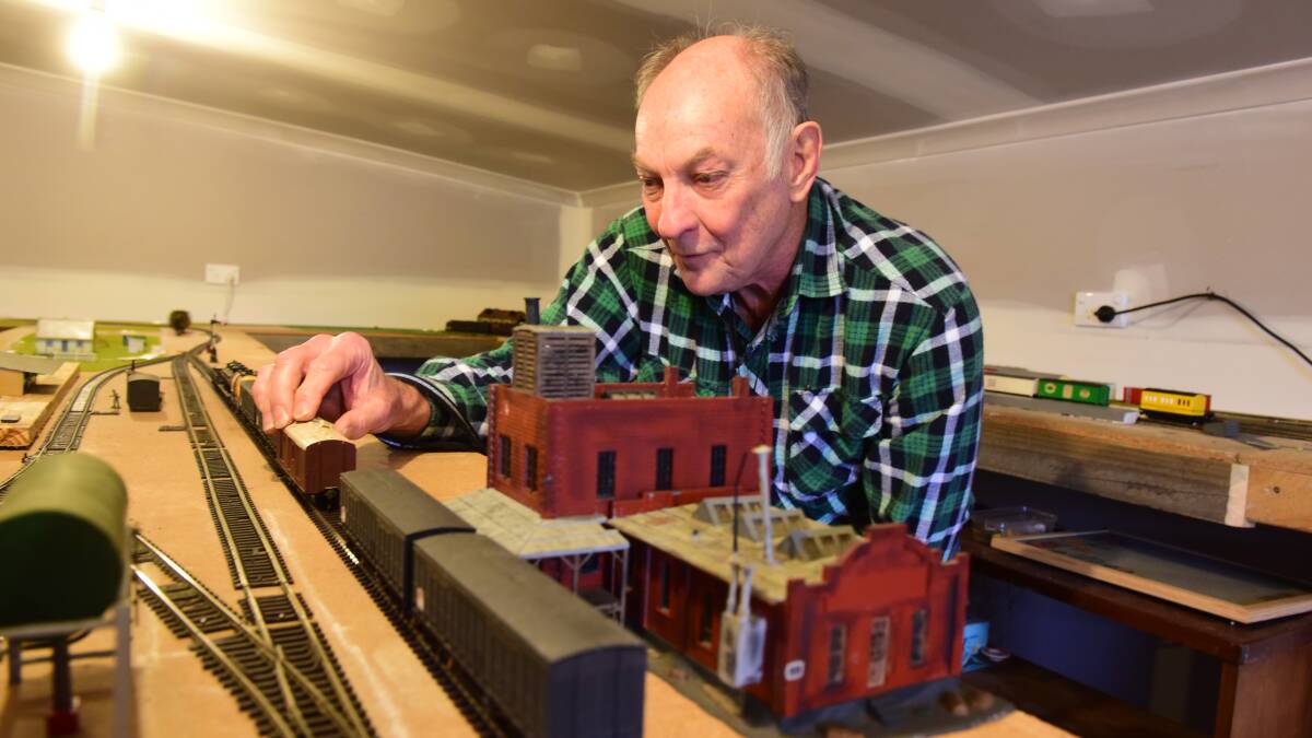 HOBBY: Mr Gleadhill with his extensive model train set at his home. He is dedicated to the expansive project, and devotes significant time to it. 