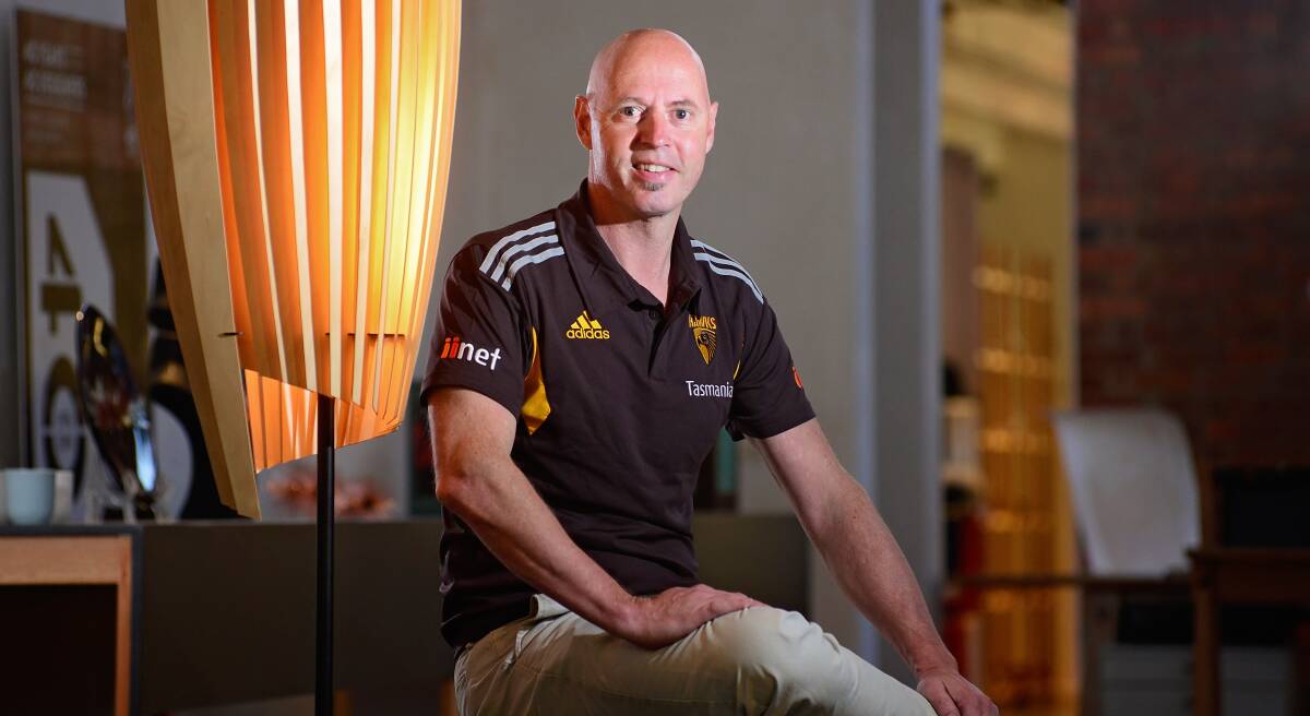 MOVING FORWARD: Hawthorn Football Club state operations manager David Cox with the the club sponsored Design Tasmania award-winning conical lamp. Picture: Phillip Biggs