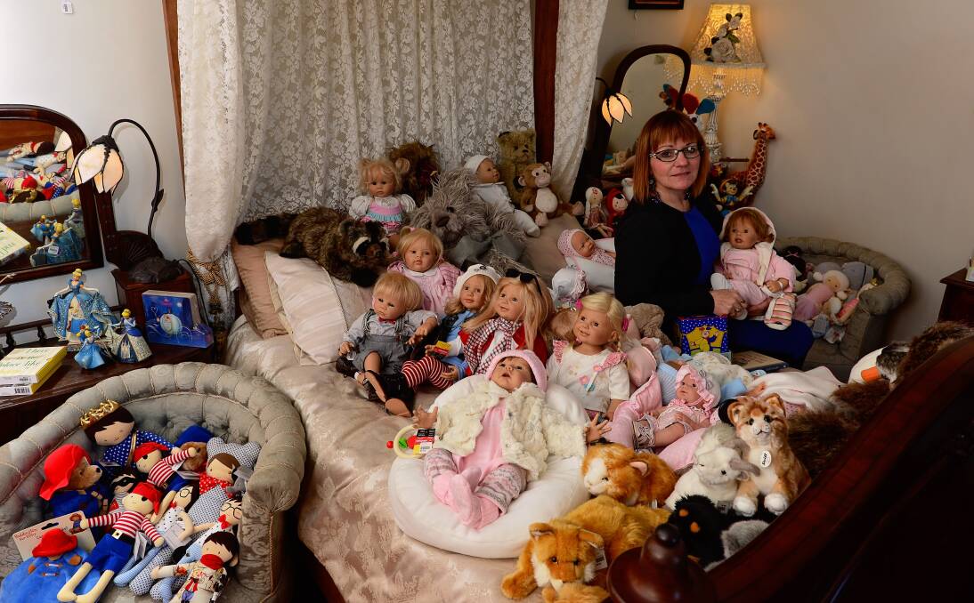 QUIRKY: Reliquaire owner Sylvia Christie sits among dolls at the store's temporary Latrobe location. Pictures: Phil Biggs 