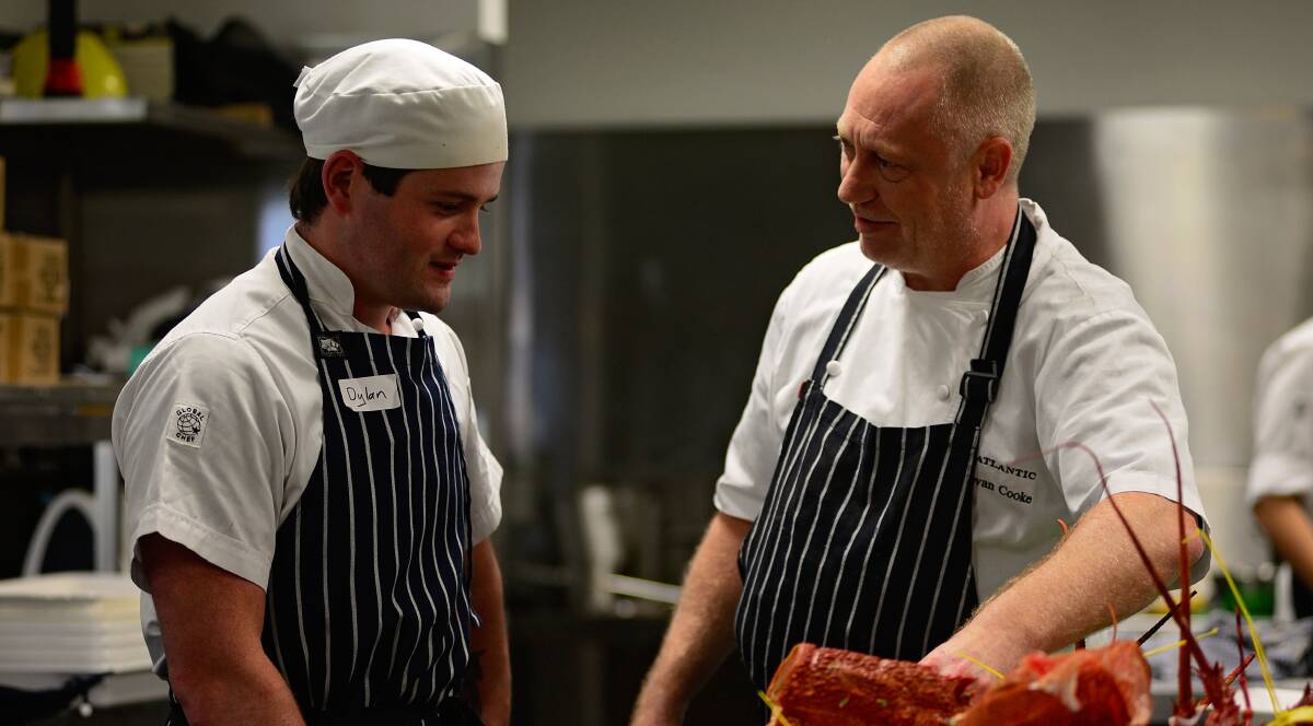 LEARNING THE TRADE: Apprentice chef Dylan Forbes with chef Donovan Cooke. Picture: Phillip Biggs 