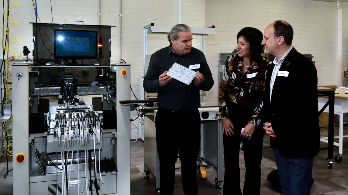 COMMUNICATION: Mike Cruse, Catherine Caruana-McManus and Andrew Maggio discuss how the agriculture sector can benefit from surface mount electronics assembling equipment. Picture: Neil Richardson 

