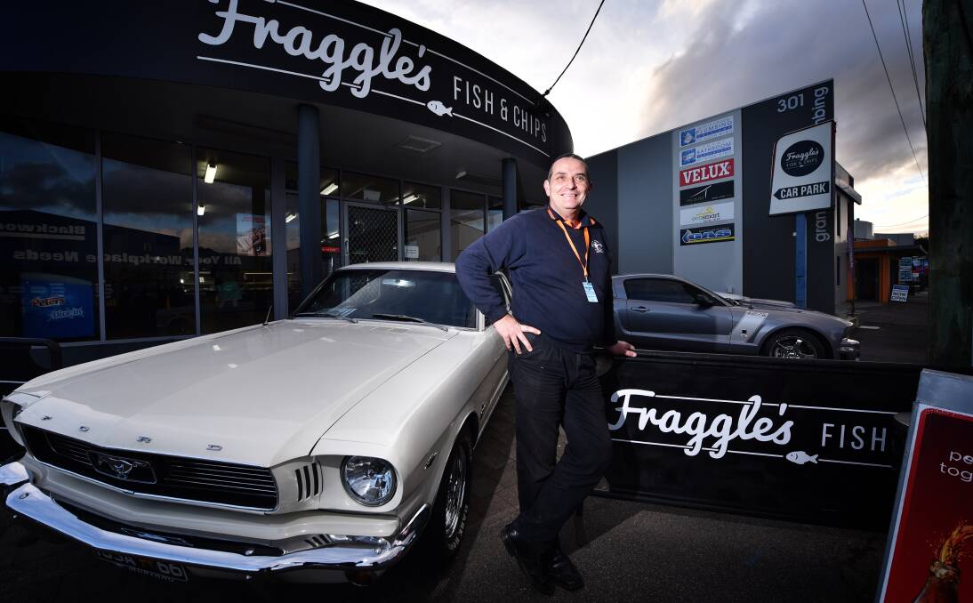 VINTAGE: Mustang Owners of Club Australia state coordinator Rodney Johnstone with a '66 and '07 Mustang.