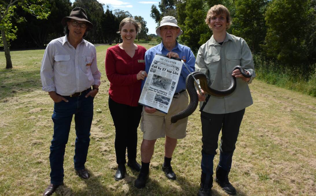 TAMAR: Roger Tyshing, Gill Basnett, Gus Green with a 1991 Examiner front page detailing the beginning of the North Esk clean up, Lachlan Macfarlane, holding a Chappell Island tiger snake.