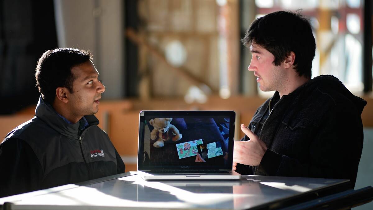 VIRTUAL: Start up entrepreneur Jonathan O'Duffy speaks with mentor Felroy Dsouza about Jonathan's augmented reality program. Photo: Phillip Biggs 