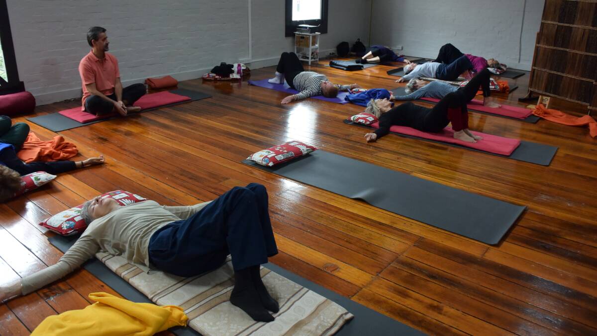 Instructor Chris Mortimer takes the 11am Hatha Yoga class. 
