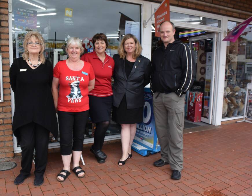 COMMUNITY SUPPORT: Maggie Mcdougall, Suzie Pryer, Sue Sherriff, Bridget Archer, Chris Barraclough outside the Newsxpress in George Town. 